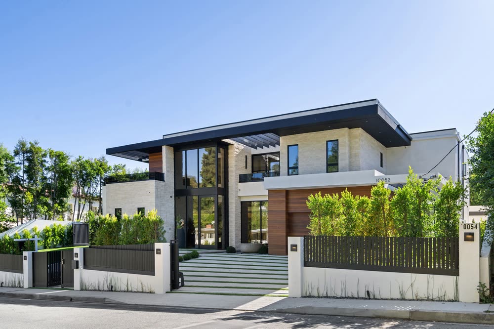 Stunning modern luxury home representing a new construction builder community